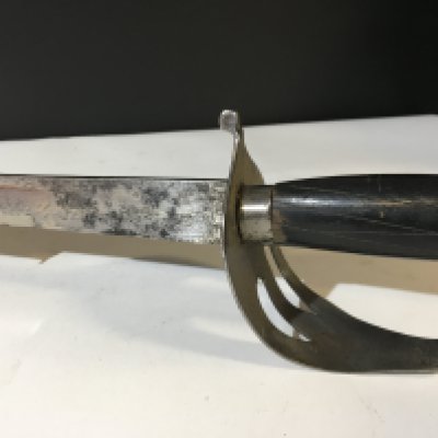 An Indian military sword the blade with an inscription and makers stamp. NO RESERVE
