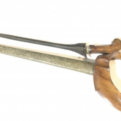 An Indonesian Kris Knife with carved wood grip and patterned scabbard. Good condition. NO RESERVE