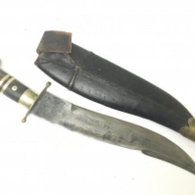 An Antique Indian dagger with an inlaid horn handle and leather and brass scabbard. length 40cm. NO RESERVE