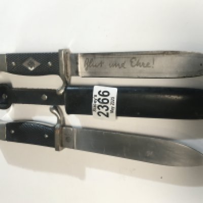 Two German Third Reich Hitler Youth Knifes both with engraved blades one without scabbard with RZ makers marks and serial number (2)
