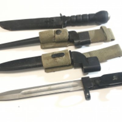 A collection of Military bayonets with woven fabric frogs post II world war issue and a Commando Knife with compass top. (4)