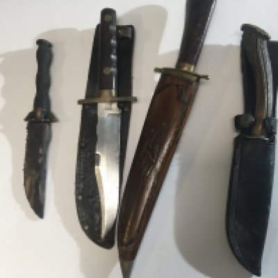 A collection of four Vintage hunting knifes one with makers stamp William and Rodgers Sheffield and three others (4)