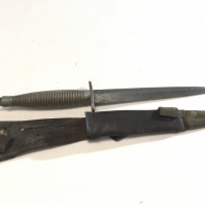 A Fairbrain Sykes commando Knife possible II world war issue and Third pattern with a ribbed grip the cross guard top edge impressed England.