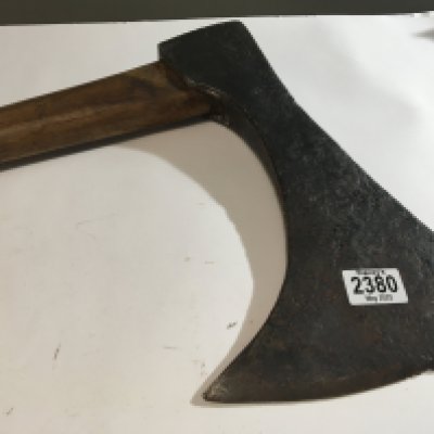 A Medieval or later executioners axe possible with a later wooden shaft the head 34cm wide.
