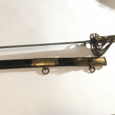 A British Navel officers sword circa 1830 the Guard with Royal Cypher the blade with elaborate decoration maker J Henderson Taunton leather scabbard with brass mounts good condition in keeping with age.