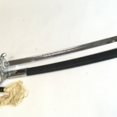 A 20th Century chrome finish cavalry sword a Quality retrospective collectors copy An American Cavalry sword with elaborate blade engraved United States Marines.