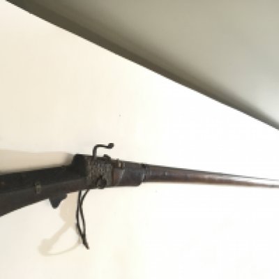 An Afghan or Indian Jazail Rifle with matchlock action applied metal ornamentation.