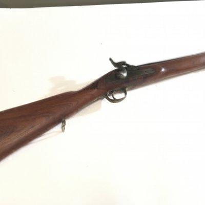 A 19th century muzzle load Percussion Rifle with full length stock brass fittings no obvious makers marks or similar.