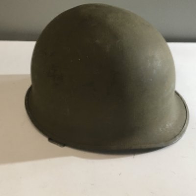 A US Army Vietnam helmet Combat helmet Mk 1 with date coinciding with the finial year of the Vietnam war 1975.