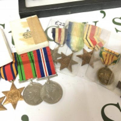 A collection of Medals including An American Vietnam service medal French Croix de Combattant. British II world war medals including Italian star Atlantic star France and German star a Group of medals including Defence and Victory medal Burma star and two other boxed medal sets,