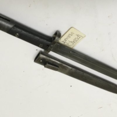 A II world war bayonet the M95 pattern Czechoslovakia bayonet with steel scabbard makers marks to the blade CSZ the bayonet also numbered B 7027. NO RESERVE