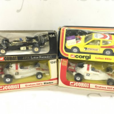 4 Boxed Corgi Lotus Cars. including 2 X Versions of Graham Hills Shaddow #s 156 And 1561. A J.P.S. lotus Formula 1 #154 And A Lotus Elite.