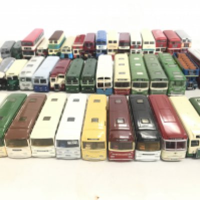 A box containing a collection of various busses to include Oxford and Corgi.