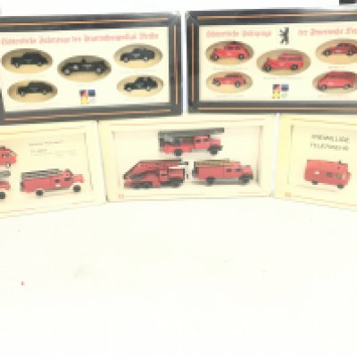 A box containing a collection of model fire engines.