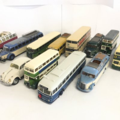 A box containing various model busses.