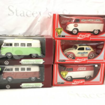 A collection of 5 boxed model Volkswagen vehicles by Solido and Road Signature includes 1962 Microbus and Coca Cola liveries. 1..18 scale. No reserve