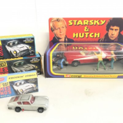 A Corgi Model Club James Bond Aston Martin DB5 #261. A Starsky And Hutch Ford Torino #202 in Repro Box. And 2 Other Bond Cars In Repro Boxes.