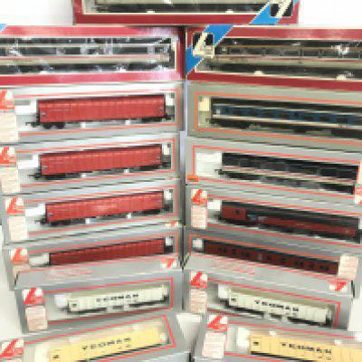 A Collection of Boxed Lima 00 Gauge Coaches And Wagons.