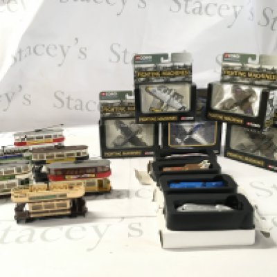 A collection of diecast models featuring 5x boxed Corgi planes in the Fighting Machines Series. 4x boxed Lledo speed record cars and 6 loose Corgi trams. No reserve
