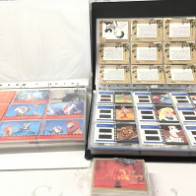 2 Binders Containing Mostly Disney Sybox And Upper Deck Cards. Including Disney Treasure Cards.