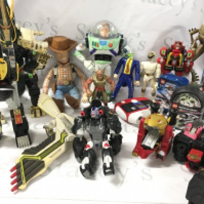 A Box Containing Playworn Toys Including Power Rangers. Toy Story And Lego.