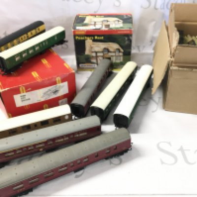 A Collection Of 00 Gauge Coaches. A Boxed City Station. A Boxed Poachers Rest. And May Other Accessories.