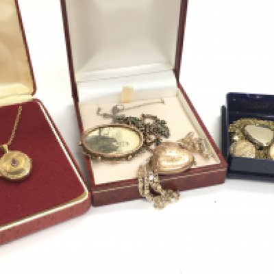 A Collection of lockets including a 14ct rose gold locket with a 9ct chain, a 9ct gold locket a 9ct gold chain etc. postage category a