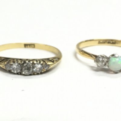 An 18ct gold ring with chip stone diamonds and an 18ct gold and platinum Opal and diamond set ring. Ring sizes L/M & M/N. Postage category a