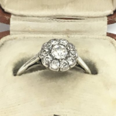 A white high carat gold ring set with old cut diamonds , size P. Postage category A