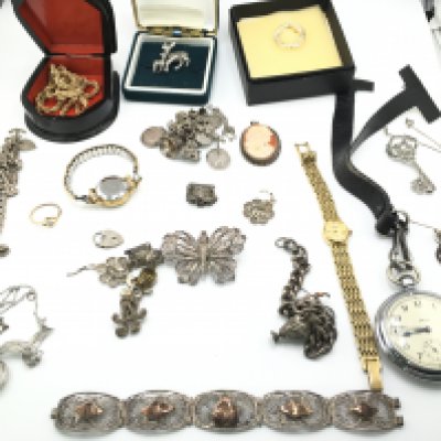 A collection of silver and costume jewellery including silver charm bracelets etc. Postage B