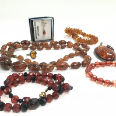 A Collection of amber including necklaces, bracelets, a ring. Postage catA