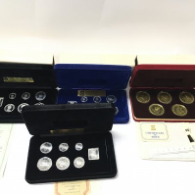 Four cased Isle of Man silver coin sets. Postage A