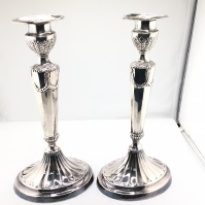 A pair of silver plate regency style candlestick holders. 25cm tall. Postage B
