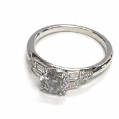 Certificated 18ct white gold diamond solitaire ring set with RBC and baguette cut diamond shoulders, boxed. Solitaire 0.90ct. Diamond shoulders 0.51ct. Cert no. WGI9624138778. Postage category A. Ring size Approx L.