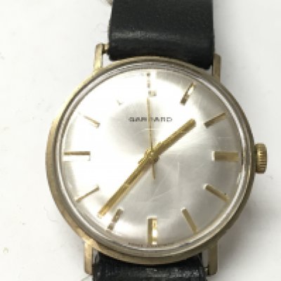 A 9ct gold Garrard wrist watch. Wind and runs. Postage B