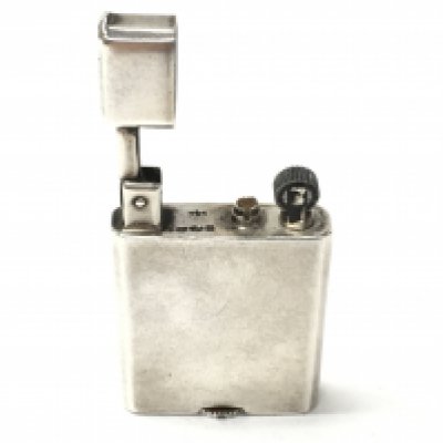 A vintage silver pocket lighter. Postage A