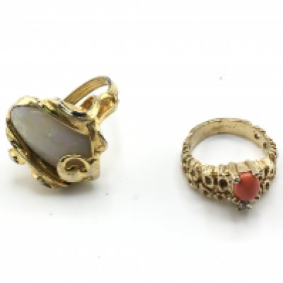 Two yellow metal one set with large opal. One size M 1/2 and other J Postage B