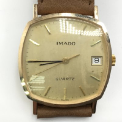 A gold case IMADO watch. Not running. Postage A