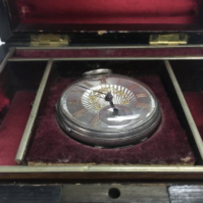 A silver hallmarked pocket watch in a presentation case. Postage category B
