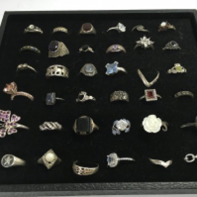 A Collection of 36 silver rings (display tray not included). Postage category A