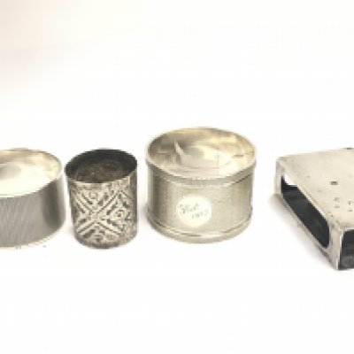 a Collection of silver hallmarked items including napkin rings, match case and a collar. Postage category B