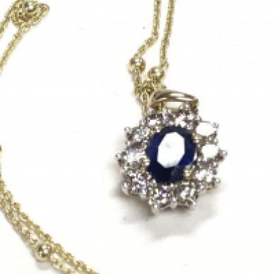 9ct yellow gold pendant set with an oval sapphire and a halo of RBC diamonds on a gold plated silver extendable chain, boxed. Sapphire 0.92ct Approx. Diamonds 0.85ct. Postage Category A.