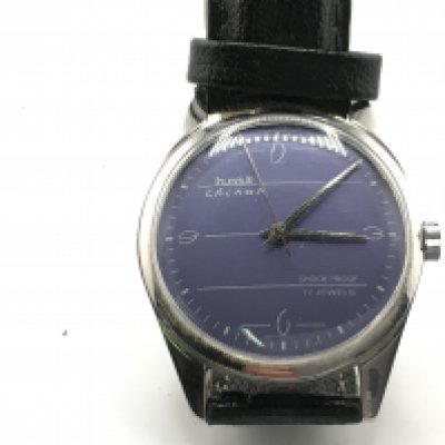 A HMT Chinan watch with an interesting dial and black leather strap. 35mm case. Not seen running. NO RESERVE