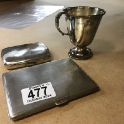 Two silver cigarette cases and a silver christening mug -294 grams