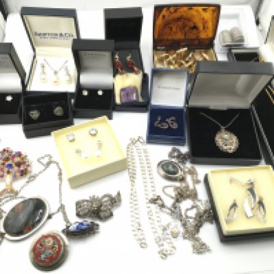 A collection of costume jewellery including a large amount of silver items. Postage B