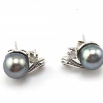 A pair of 9ct white gold pearl earrings. Postage A