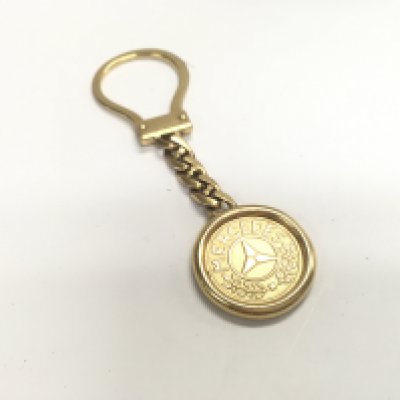 A 9ct gold Mercedes fob key chain. Approx weight 15.13 grams.