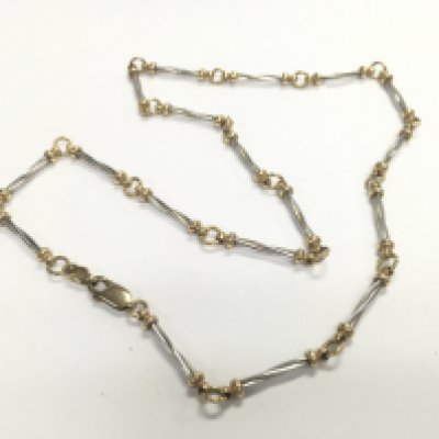 A 9ct gold two tone fancy link necklace. Approx weight 12.24 grams.