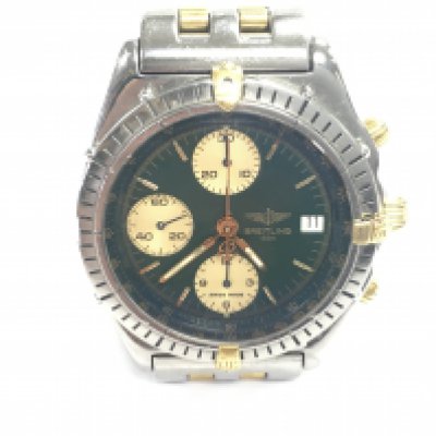 A Breitling chronomat wrist watch with green dial. Case is approximately 40mm excluding crown. Seen running.