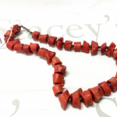 A heavy Coral and white metal beaded necklace. (A)